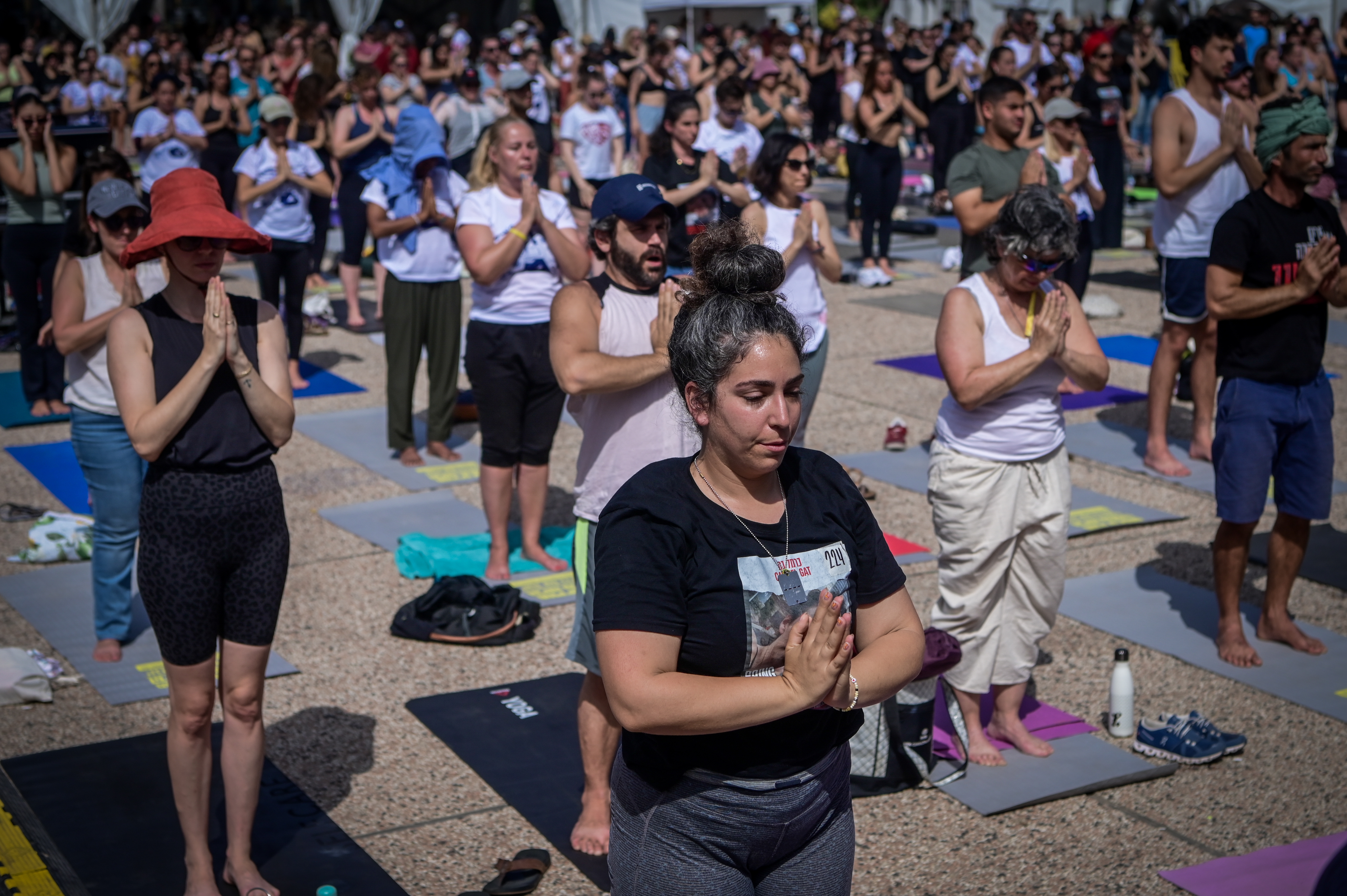People practicing yoga at "Hostage Square" in Tel Aviv to mark the 40th birthday of Israeli captive in Gaza Carmel Gat, May 17, 2024. Photo by Avshalom Sassoni/Flash90
