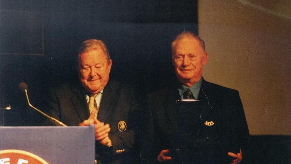 Joseph (Yosef) Dagan (right) after receiving the UEFA Order of Merit in Ruby from then-UEFA president Lennart Johansson in Stockholm in 2002. Credit: IFA.