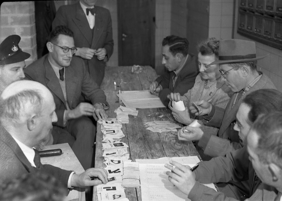 Polling station officials arrange ballot slips during Israel’s first national election on Jan. 25, 1949. Credit: Benno Rothenberg/Meitar Collection/National Library of Israel/The Pritzker Family National Photography Collection.