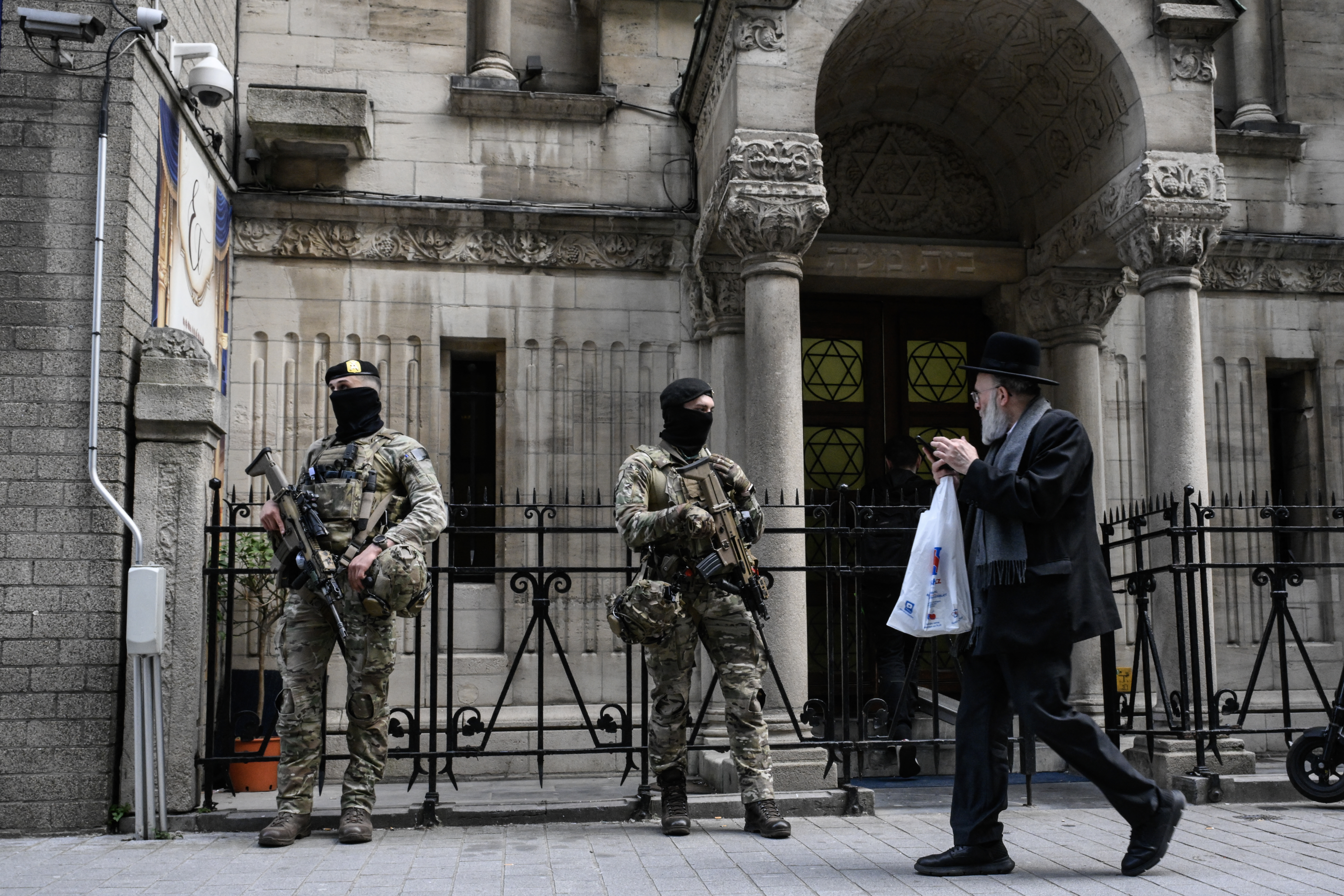 Belgian soldiers stand guard outside a synagogue in central Antwerp, Belgium, March 23, 2026, amid heightened security measures established at Jewish schools and houses of worship across the country. Photo by John Thys/AFP via Getty Images.
