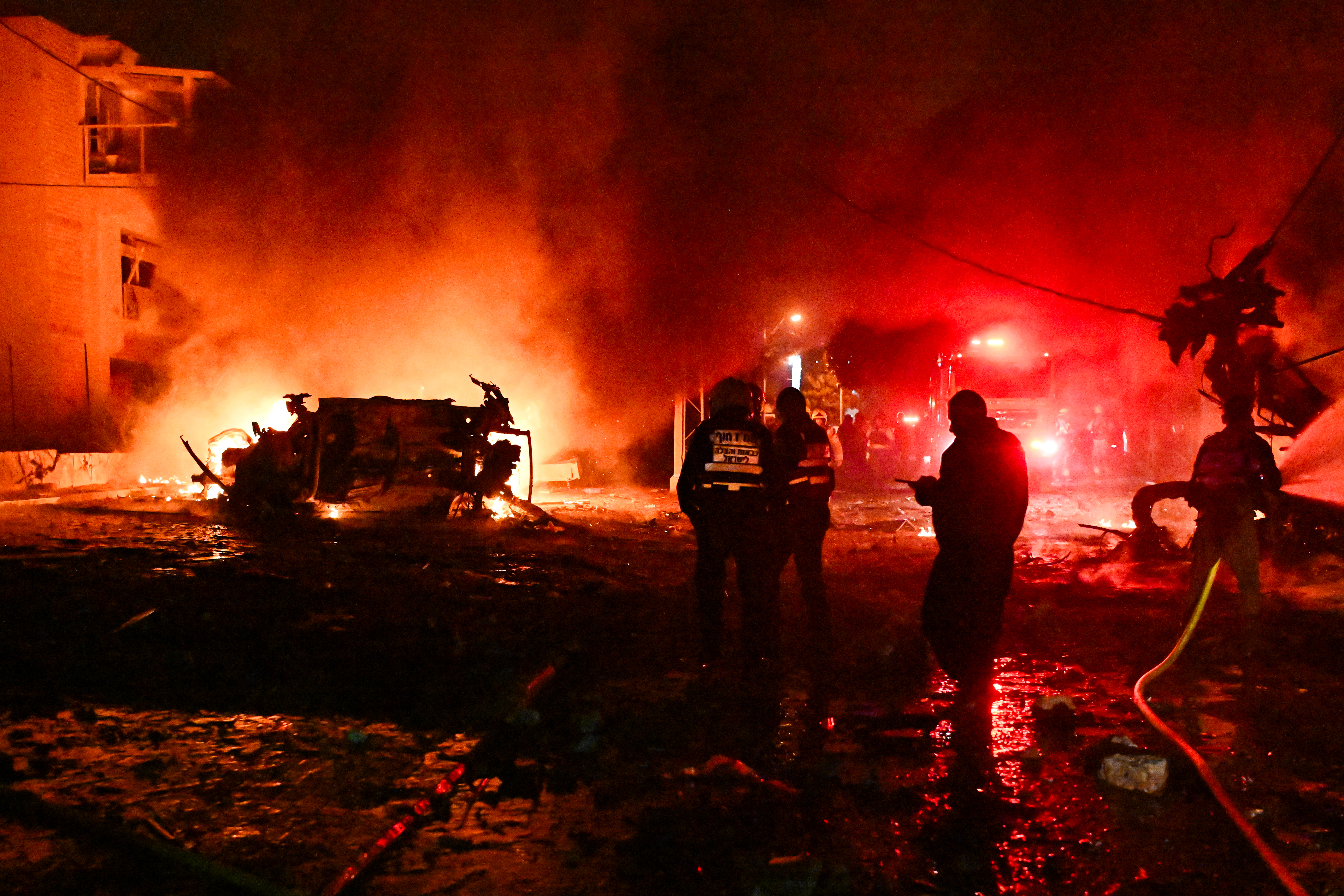 Israeli security and rescue forces at the scene of an Iranian ballistic missile hit in Haifa | Photo by Flash90.
