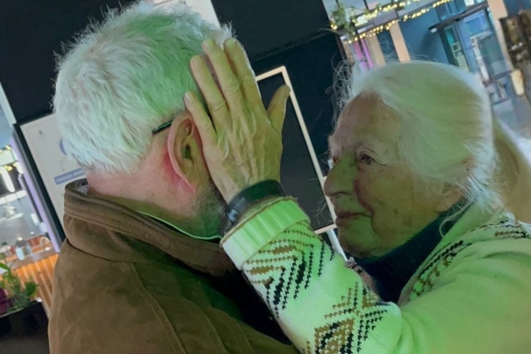 Reunited after 80 years, two child survivors light a memorial torch at Auschwitz