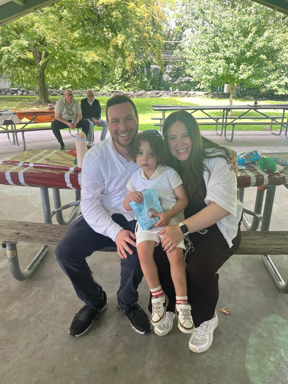 Brent and Alissa Weinberg with their son, Netanel (Tani), in Stamford, Conn., September 2026. Credit: Courtesy of the Weinberg family.