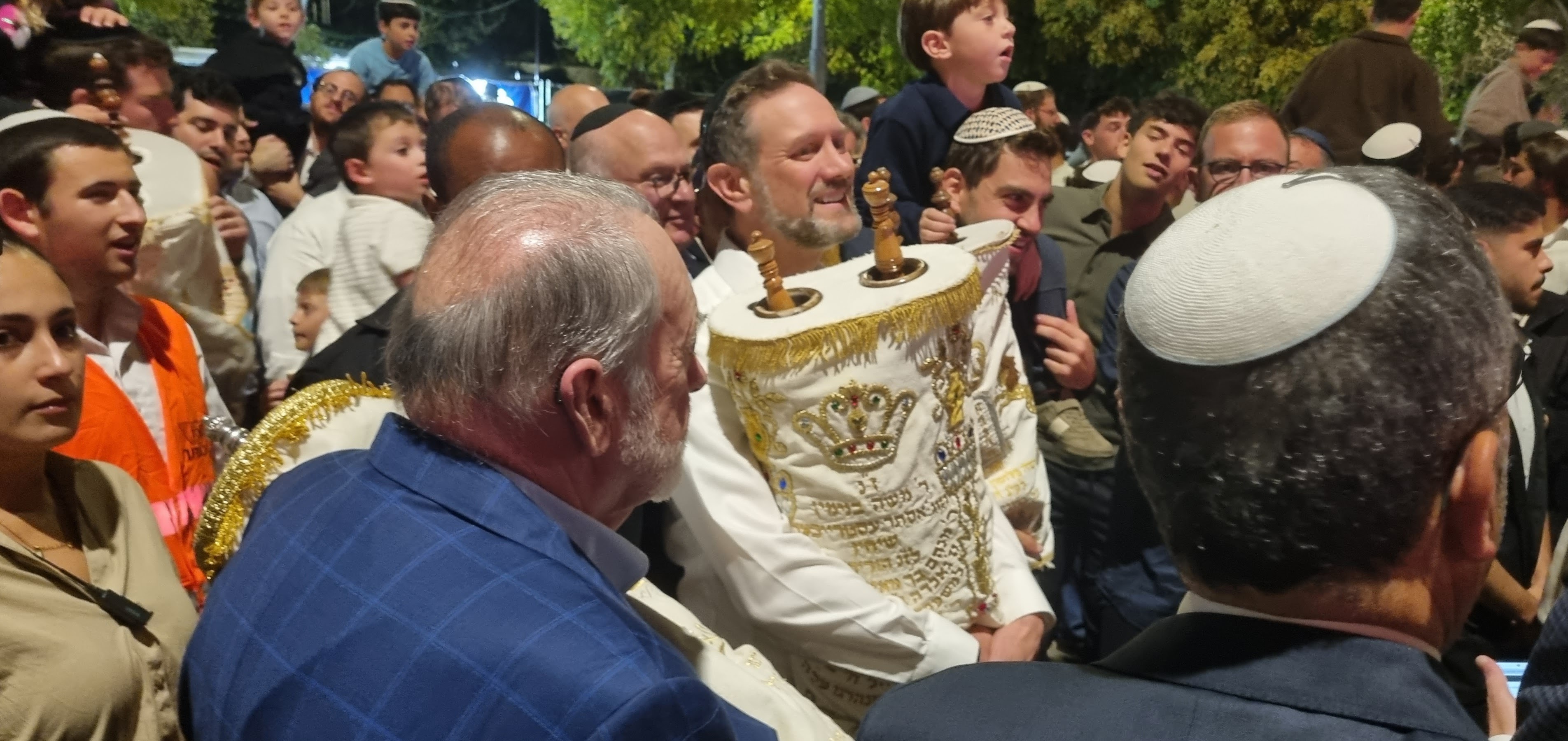 Rabbi Yehuda Seif, the head of Midreshet Torah v'Avodah, dances with a Torah at Liberty Bell Park in Jerusalem on Oct. 3, 2026. Photo by Sharon Altshul.