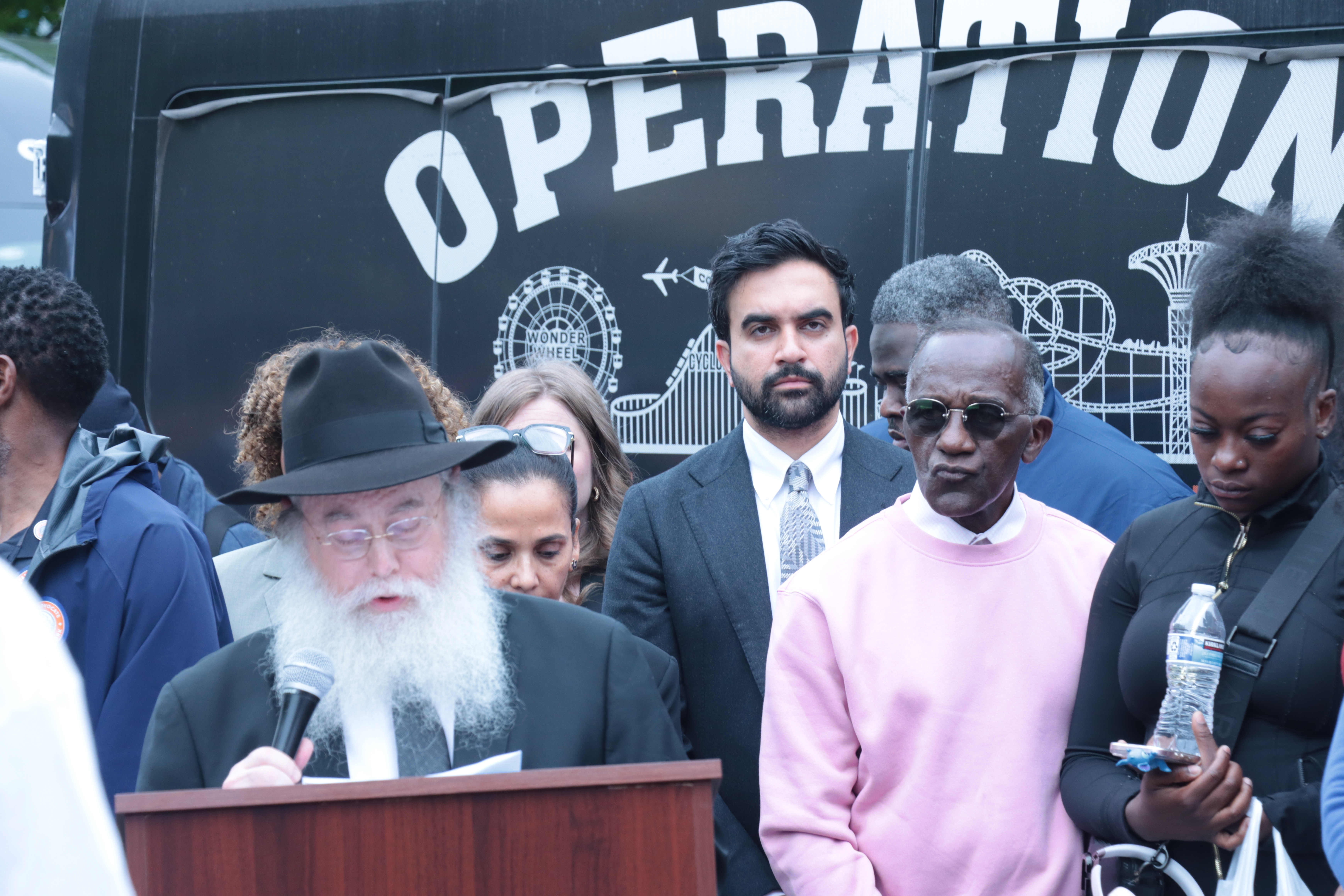 Rabbi Moshe Wiener speaks at Operation H.O.O.D. shooting response gathering. Coney Island, N.Y. July 7, 2026. Credit: Courtesy.