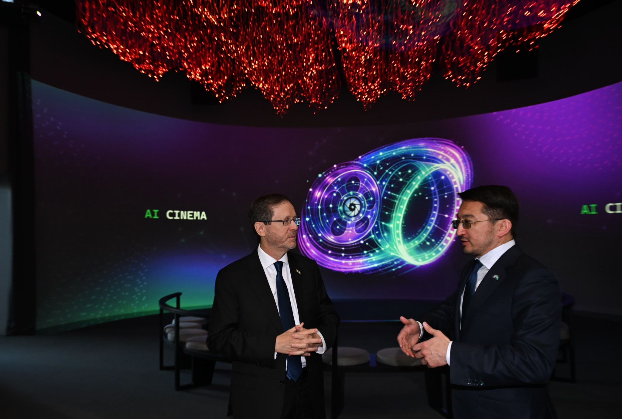 Kazakhstan's deputy prime minister and minister of artificial intelligence and digital development, Zhaslan Madiyev, right, and Israeli President Isaac Herzog speak at a museum in Astana, Kazakhstan on April 28, 2026. Photo by Haim Zach/GPO.