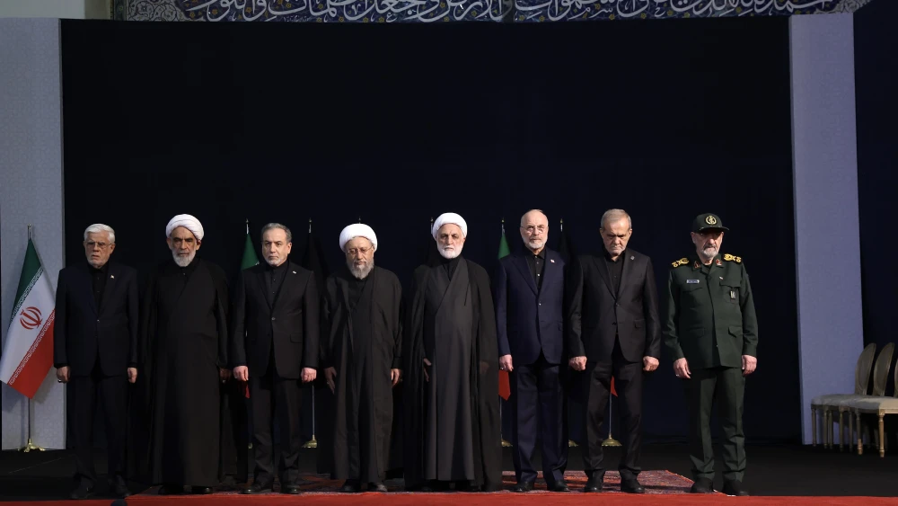 From left: Secretary of Iran’s Supreme National Security Council Mohsen Rezaei, Iranian President Masoud Pezeshkian, Iranian Parliament Speaker Mohammad Bagher Ghalibaf, Chief Justice of Iran Gholam-Hossein Mohseni-Eje’i, the chairman of the Expediency Discernment Council Sadeq Larijani and Iranian Foreign Minister Abbas Araghchi greet guests and family members arriving for a ceremony for the remains of slain Ayatollah Ali Khamenei at the Imam Khomeini Grand Mosque in Tehran, July 3, 2026. Photo by Meghdad Madadi, ATP Images/Getty Images.