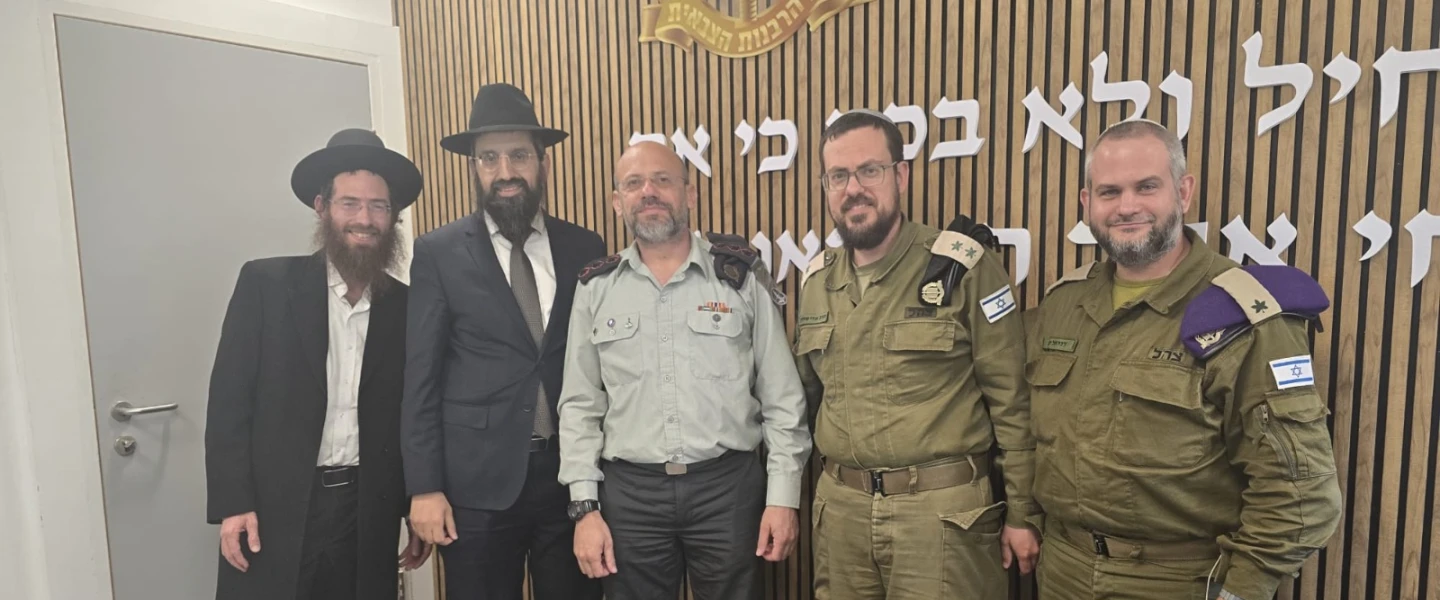 Representatives of the International Halacha Institute and the IDF Military Rabbinate meet at Camp Shura on May 13, 2026. Pictured (from left): Rabbi Nachum Borshtein, head of the IHI Rabbanut Department; Dayan Avraham Y. Dadoun, founder and CEO of the International Halacha Institute and head of the South Florida Bet Din; Col. Rabbi Chaim Weissberg, head of the IDF Military Rabbinate Department; Rabbi Udi Schwartz, head of the IDF Military Rabbinate Halacha Department; and Brig. Gen. Rabbi Daniel Kind, senior military rabbi. Credit: Courtesy of the International Halacha Institute.