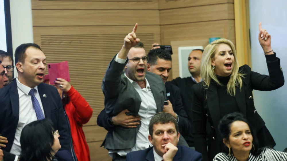 Israeli opposition lawmakers shout at members of the coalition during a meeting of the Knesset’s Constitution, Law and Justice Committee, which voted to send the first bill in the government's judicial reform package for its first reading in the full plenum, Feb. 13, 2023. Credit: Yonatan Sindel/Flash90.