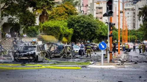 Security and rescue personnel at the scene where a Gazan rocket hit apartment buildings and cars in Ashdod on Oct. 9, 2023. Photo by Liron Moldovan/Flash90.