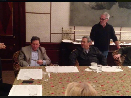 From left, seated: billionaire Thomas Pritzker, former Israeli Prime Minister Ehud Barak and filmmaker Woody Allen; magician David Blaine stands at left, while the late financier Jeffrey Epstein stands between Barak and Allen, in an undated photo from Epstein’s estate released on Dec. 18, 2025. Source: House Oversight Democrats.