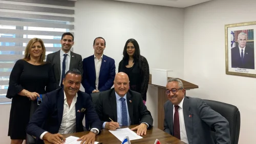 Israel's Ambassador in Morocco David Govrin (center) signs a contract to build an embassy in Rabat, Aug. 2, 2022. Source: Twitter/David Govrin.