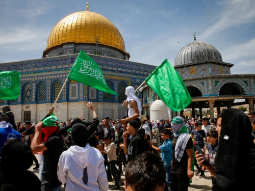 Muslims wave Hamas flags after Friday prayers during Ramadan on the Temple Mount in Jerusalem, April 22, 2022. Photo by Jamal Awad/Flash90.