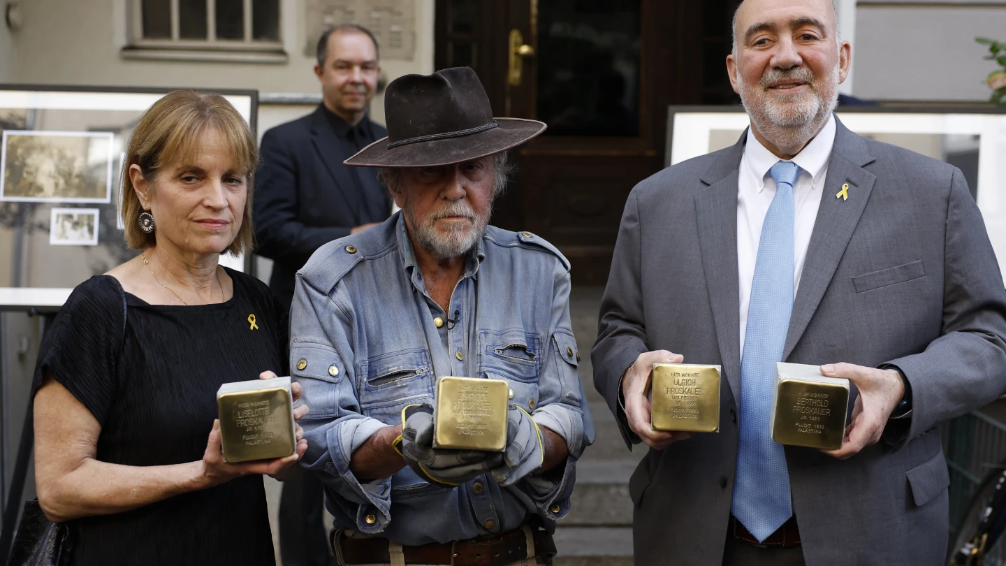 Photo: JNS.org Israeli ambassador to Germany Ron Prosor (R), his wife Hadas (L) and Gunter Demnig, founder of the Stolpersteine project