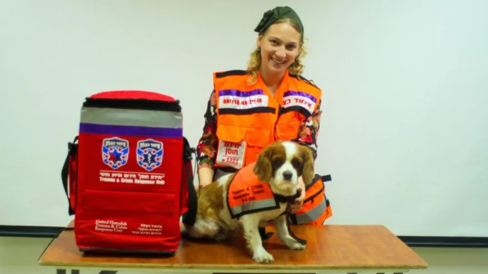Lucy and her handler, Batya Yaffe. Credit: United Hatzalah.