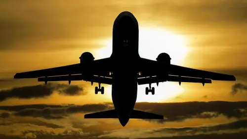 Silhouette of plane flying. Credit: Pixabay.