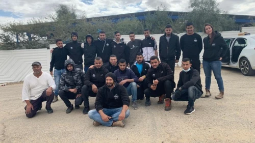 The Bedouin volunteers who fixed up a vandalized Jewish graveyard in the Negev. At left, in white, is Yochai, the cemetery’s caretaker. Photo courtesy of Desert Stars.