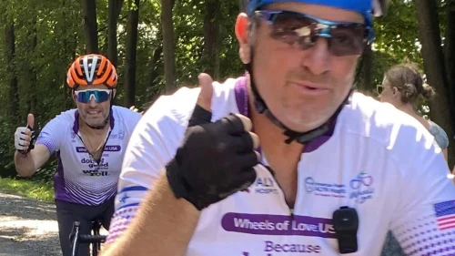 Fundraising Cyclist giving a thumbs up