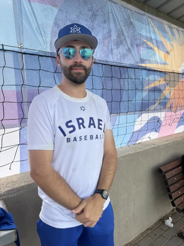 Team Israel manager Freddy Bain in the dugout before game versus Team USA in Ra'anana, July 7, 2026. Photo by Howard Blas.