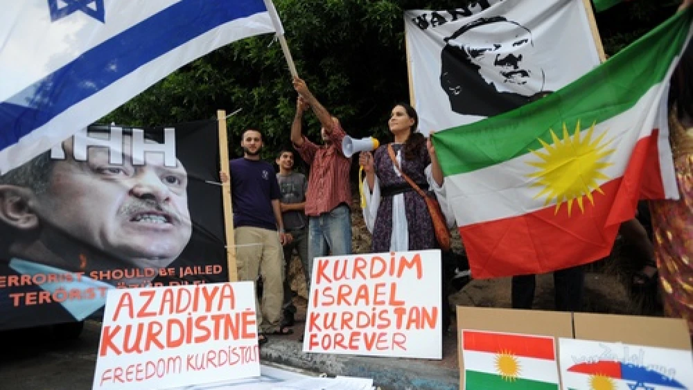 Israelis hold up placards, including a portrait of Turkey's Prime Minister Recep Tayyip Erdogan labeled wanted, during an anti-Turkish protest outside the Turkish embassy in Tel Aviv on July 8, 2010. Credit: Gili Yaari/Flash 90.