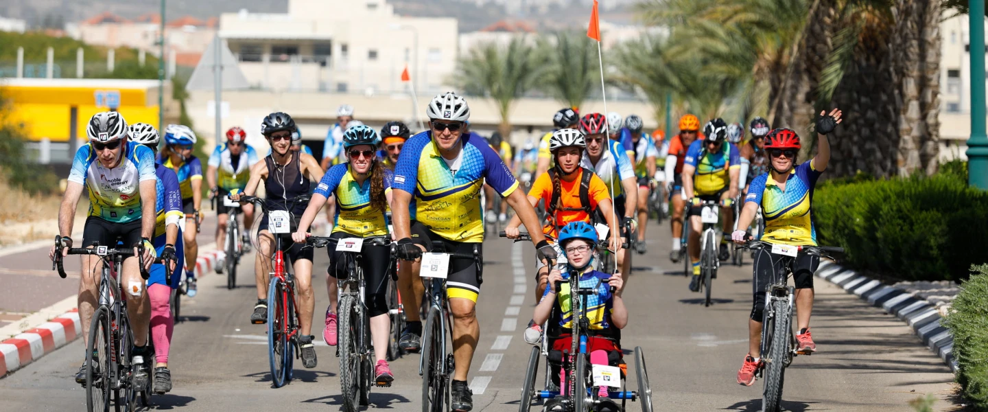 Adults and kids participate in the “Wheels of Love” annual bike race in Israel. Credit: Tomer Feder Sport Photography.