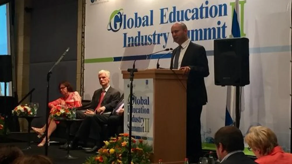 Israel's Minister of Education Naftali Bennett addresses the Organization for Economic Cooperation and Development summit in Jerusalem. Credit: Eliana Rudee.