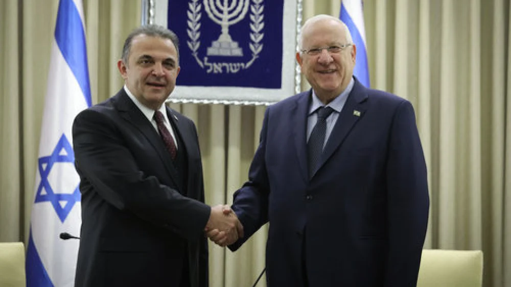Israeli President Reuven Rivlin (right) with Kemal Okem, Turkey’s first ambassador to Israel since the restoration of those countries’ diplomatic relations, in Jerusalem Dec. 12, 2016. Credit: Isaac Harari/Flash90.