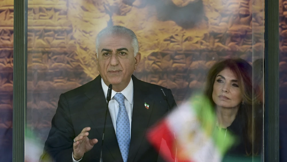 Reza Pahlavi, the exiled Iranian crown prince, and his wife during a demonstration in Berlin, April 23, 2026. Photo by John MacDougall/AFP via Getty Images.