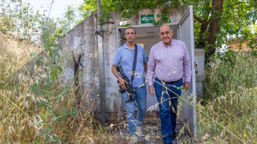 David Azulay, left, head of the Metula Regional Council, exits a bomb shelter with Shlomi Mayor Gabi Naaman, Metula, Israel, May 7, 2024. Photo by Yossi Aloni/Flash90.
