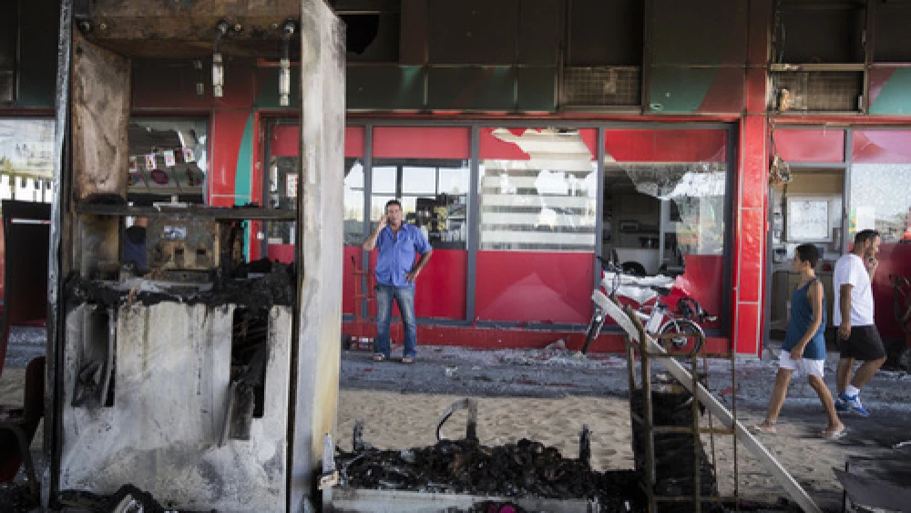 Click photo to download. The scene of a gas station in Ashdod that was hit directly by rocket fire from Gaza on the fourth day of Operation Protective Edge, July 11, 2014. Credit: Hadas Parush/Flash90.