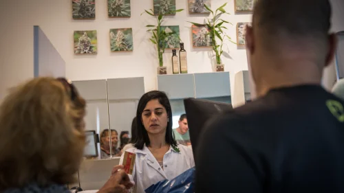 Pharmicists supply patients with prescribed medical marijuana at the "Tikun Olam" store in Tel Aviv, on April 10, 2016. Tikun Olam Ltd. is the first, largest and foremost supplier of medical cannabis in Israel, and is one of leading medical cannabis companies in the world. April 10, 2016. Photo by Hadas Parush/Flash90.