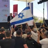 Protesters chant "traitor" as Yair Golan speaks at a conference in Be'er Sheva, Israel on may 27, 025. Photo by Canaan Lidor.