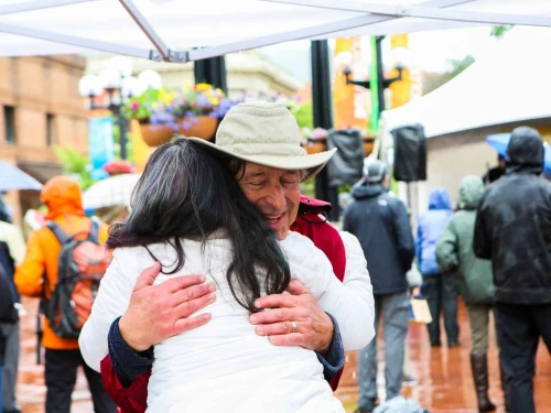 A man hugs a woman at the 2024 Jewish festival in Boulder, Colorado. Photo Credit: The Boulder Jewish Festival.