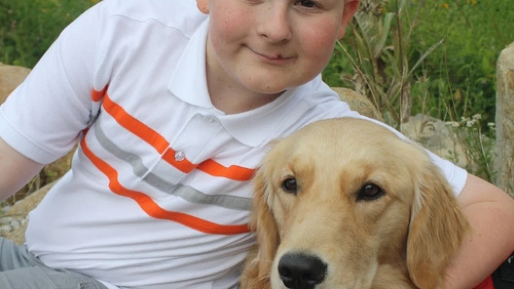 William Snyder and his service dog, Asha. Credit: Courtesy Snyder family.