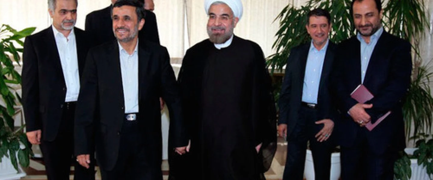 Iranian President Hassan Rouhani (center) with his predecessor, Mahmoud Ahmadinejad (second from left), in June 2013. Credit: Wikimedia Commons.