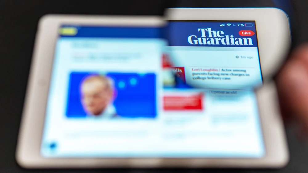 “The Guardian News” website homepage on a tablet. Credit: Anton Garin/Shutterstock.