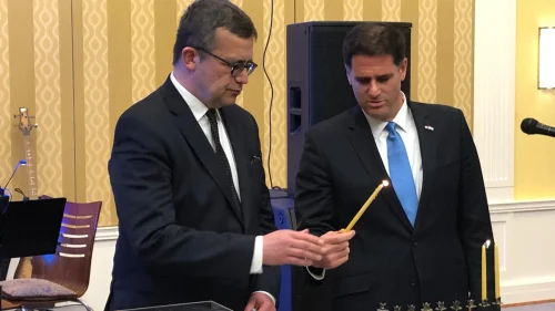 Israeli Ambassador to the United States Ron Dermer lights the menorah on the second night of Hanukkah with the help of Polish Ambassador to the United States Piotr Wilczek at the Polish embassy in Washington, D.C., on Dec. 3, 2018. Credit: Ambassador Ron Dermer/Twitter.