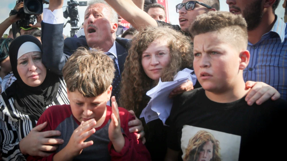 Palestinian teenager Ahed Tamimi is welcomed by relatives and supporters after she was released from prison in Israel on July 29, 2018. Photo by Flash90.