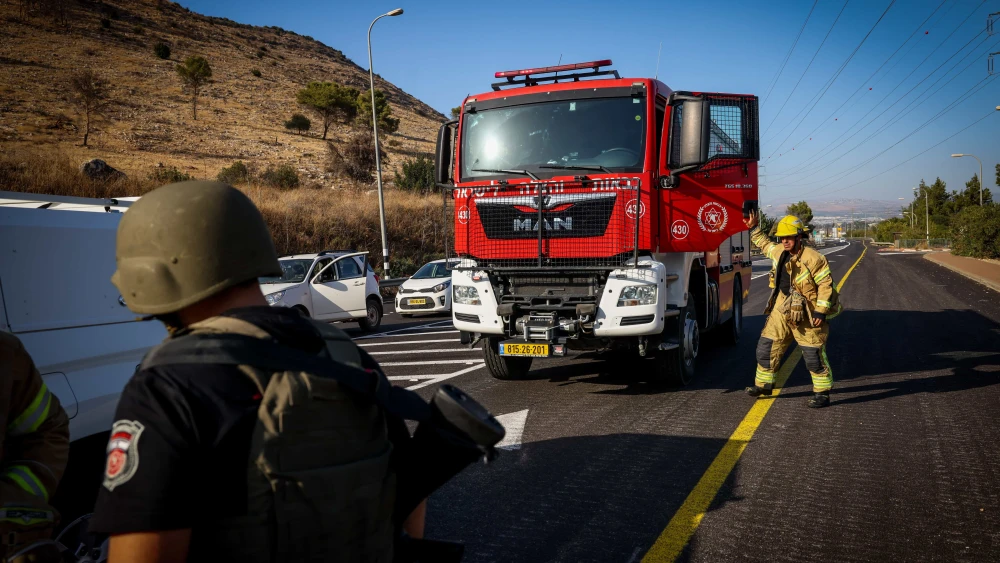 Firefighters arrive at Kibbutz Yiftach in northern Israel on Nov. 5, 2023. Photo by David Cohen/Flash90.