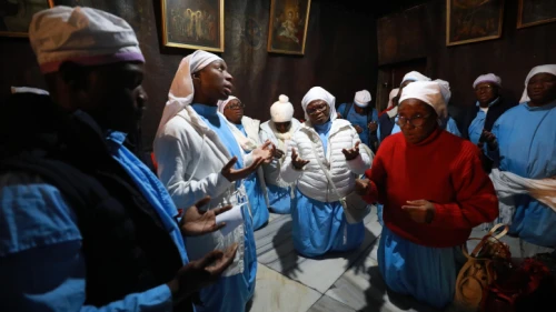 Christian pilgrims pray inside the Church of the Nativity in the West Bank city of Bethlehem, on Dec. 24, 2019. Photo by Flash90.