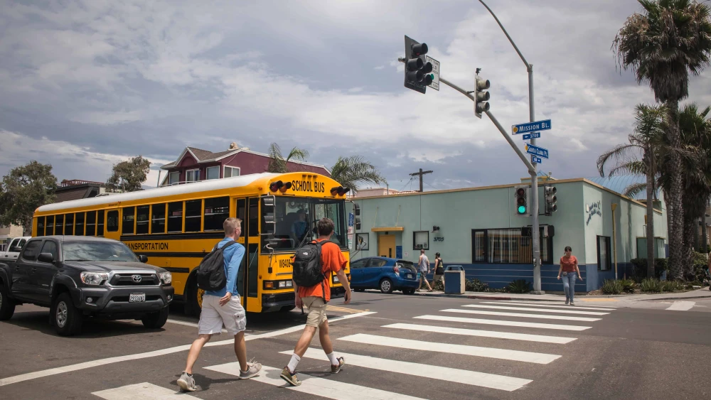School-age teens crossing the street in the Mission Bay area of San Diego. Credit: Conchi Martinez/Shutterstock.