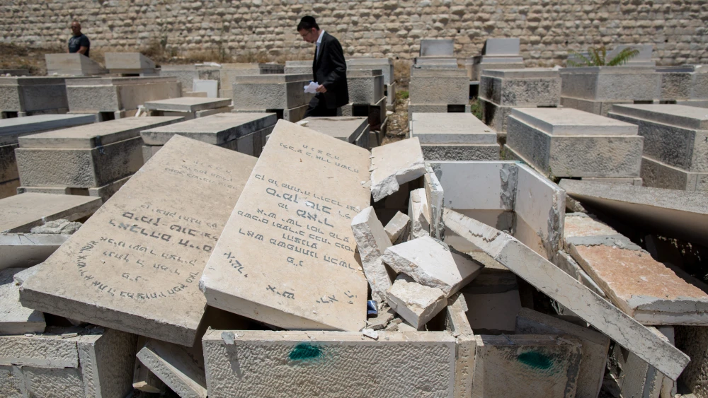A view of the desecrated tomb stones that was vandalized by unknown assailants in the Mount of Olives cemetery in East Jerusalem on June 23, 2015. Credit: Yonatan Sindel/Flash90