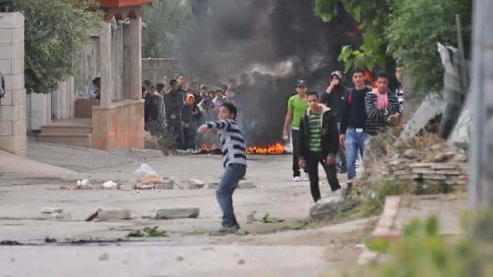 File photo: Palestinian rioters hurl rocks and firebombs at Israeli security forces in El-Arrub, southwest of Bethlehem. Credit: Israel Defense Forces.