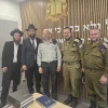 Representatives of the International Halacha Institute and the IDF Military Rabbinate meet at Camp Shura on May 13, 2026. Pictured (from left): Rabbi Nachum Borshtein, head of the IHI Rabbanut Department; Dayan Avraham Y. Dadoun, founder and CEO of the International Halacha Institute and head of the South Florida Bet Din; Col. Rabbi Chaim Weissberg, head of the IDF Military Rabbinate Department; Rabbi Udi Schwartz, head of the IDF Military Rabbinate Halacha Department; and Brig. Gen. Rabbi Daniel Kind, senior military rabbi. Credit: Courtesy of the International Halacha Institute.