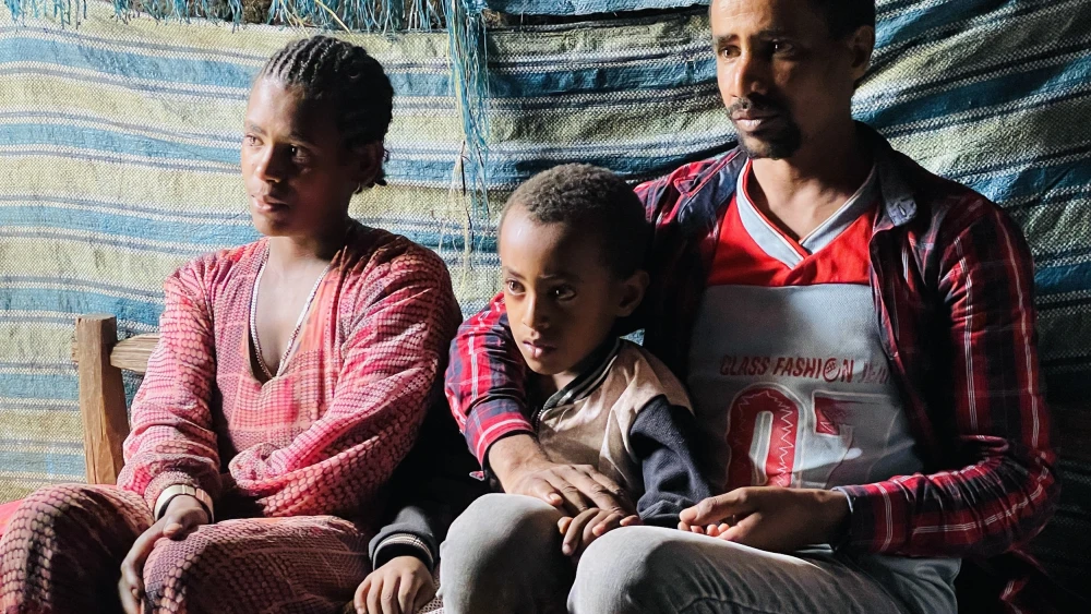 Zemenu Atalele Genet, 30; his wife Yeshihareg, 23; and their 3-year-old son. Photo by Eliana Rudee.