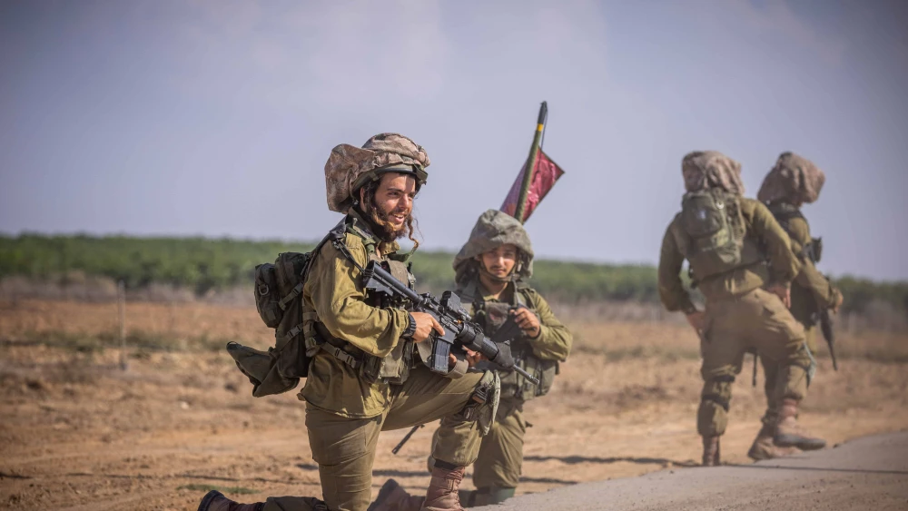 Israel Defense Forces soldiers of the Netzach Yehuda Battalion patrol near the Gaza border, Oct. 20, 2023. Photo by Yonatan Sindel/Flash90.