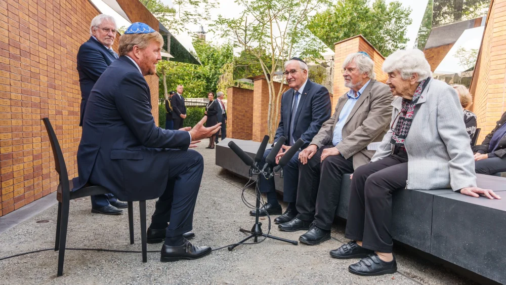 King Willem-Alexander of the Netherlands speaks with Holocaust survivors at the country's new Holocaust memorial in Amsterdam, Sept. 19, 2021. Source: Koninklijk Huis/Twitter.