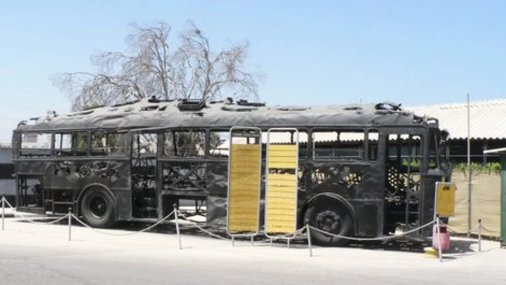 Click photo to download. Caption: The charred remains of an Israeli bus that was attacked by Palestinian terrorists in the March 1978 Coastal Road massacre. Credit: MathKnight via Wikimedia Commons.