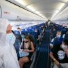 Israir Airlines flight attendants in full protective gear on a flight between Tel Aviv and Eilat on Aug. 17, 2020. Photo by Olivier Fitoussi/Flash90.