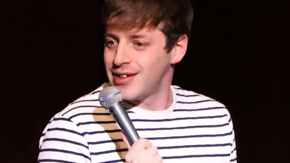 Alex Edelman performs at Memorial Hall at the University of North Carolina in Chapel Hill, Jan. 29, 2024. Credit: Hameltion via Wikimedia Commons.